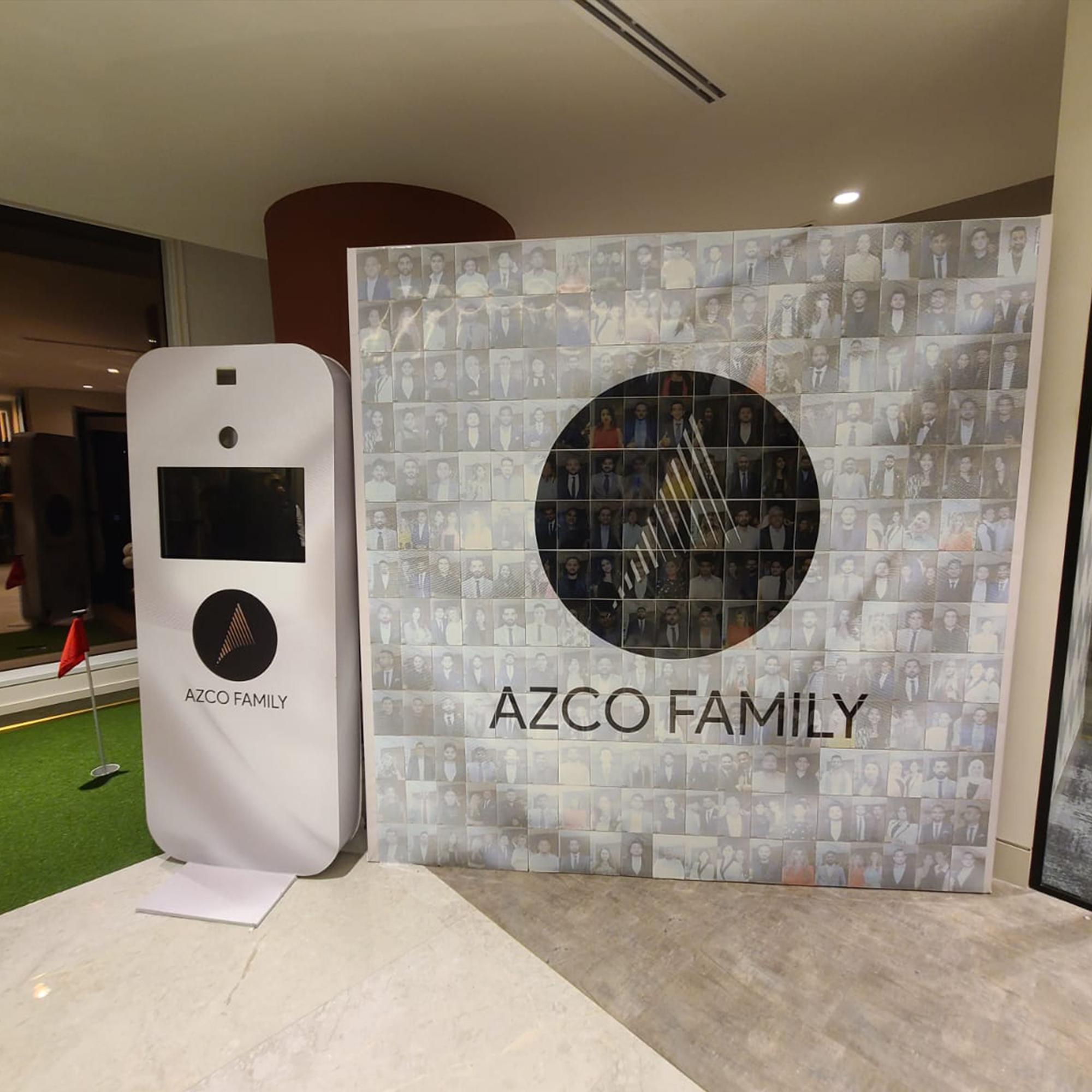 Guests adding photos to a digital mosaic wall, creating a collaborative image masterpiece at a live event.