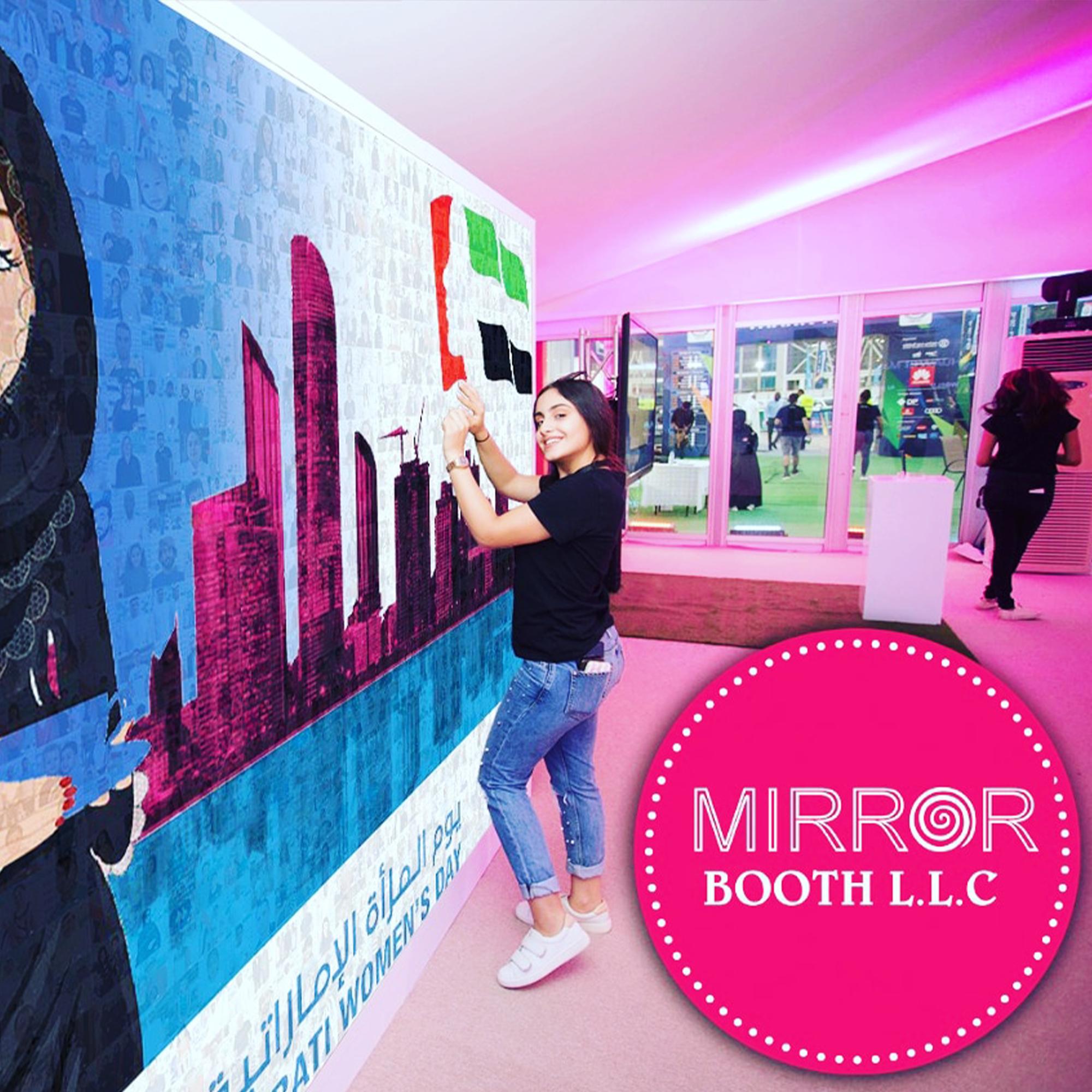 Guests adding photos to a digital mosaic wall, creating a collaborative image masterpiece at a live event.