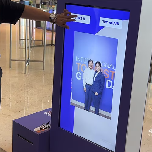 Guests enjoying an AI-powered photo booth with instant background removal and immersive virtual scenes—no green screen required.