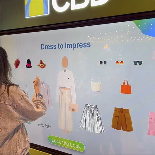 People playing a multi-level interactive financial literacy game at a brand activation event in Dubai, learning how to save and invest money.