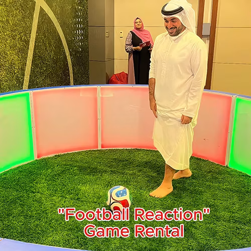Custom-branded Interactive Football Arena setup at a Dubai exhibition venue with an electronic leaderboard for competition