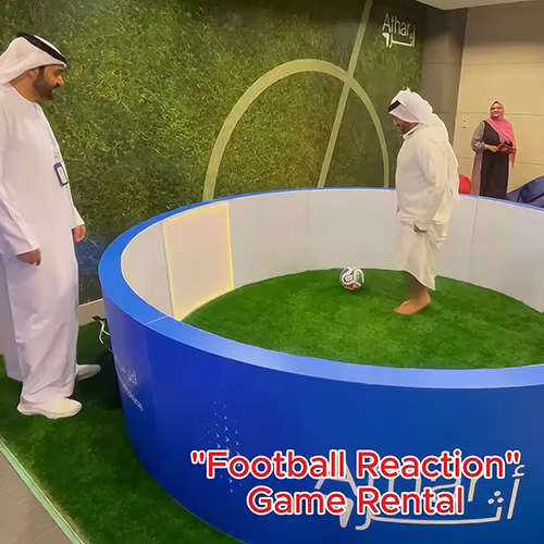 Custom-branded Interactive Football Arena setup at a Dubai exhibition venue with an electronic leaderboard for competition