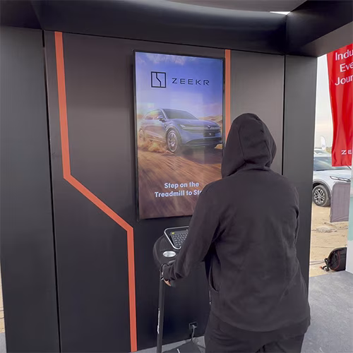 Interactive Treadmill Activation in Dubai: Participants generating human power to recharge EV cars
