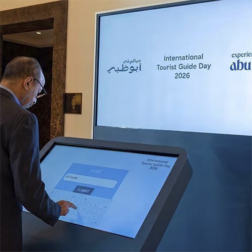 Multi-screen interactive UAE landmark guessing game display with custom branded interface for immersive event activation and digital tourism engagement.