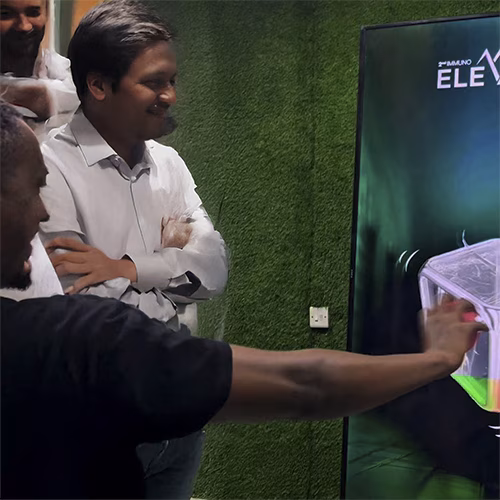 Guests playing Move Shake Pose AR game at a brand activation booth in Dubai event