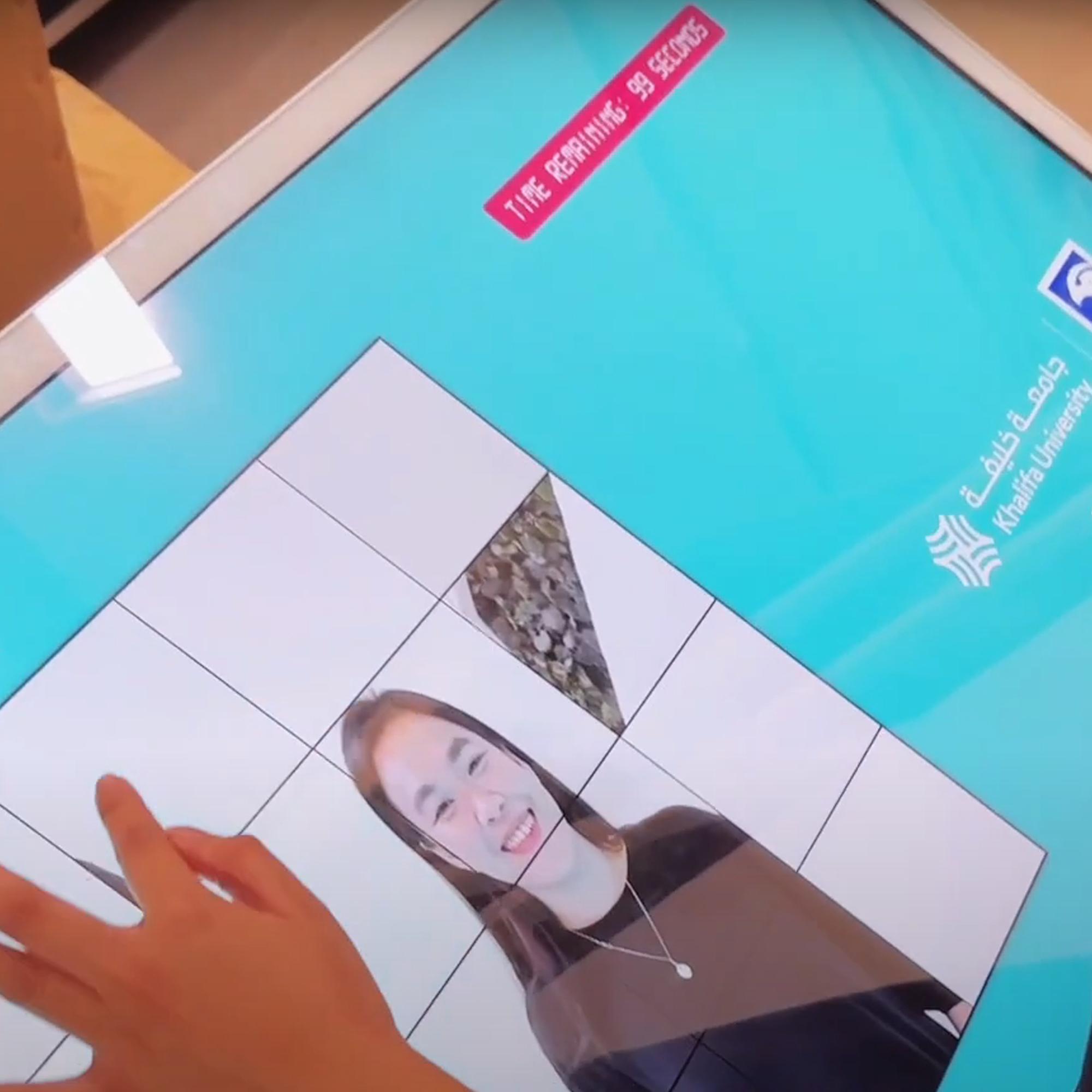 Player solving a shuffled photo puzzle of their face during an interactive event challenge.