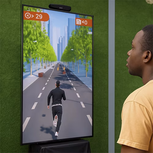 Player enjoying a motion runner game in Dubai, using full-body movement to jump and dodge obstacles. Interactive game rental