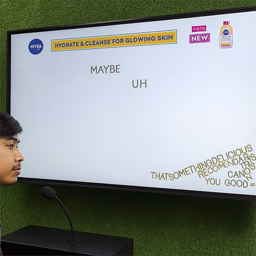 Arab woman using Sayit AI at a Dubai corporate event, speaking into a mic as 3D branded text appears on a large screen, showcasing interactive event technology rental