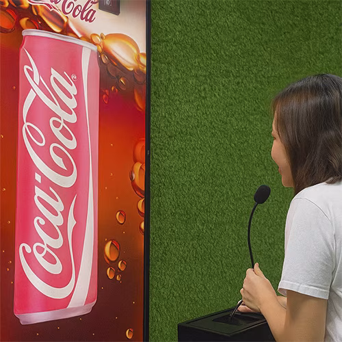 people playing the Interactive Scream Game at an event in Dubai, cheering and shouting to control to win the game