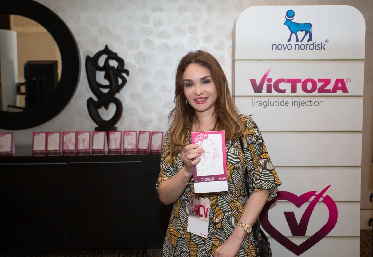 Guest using Text Selfie Photo Booth at an event in Dubai, receiving a printed word cloud image made from their photo with custom branded text for marketing activation