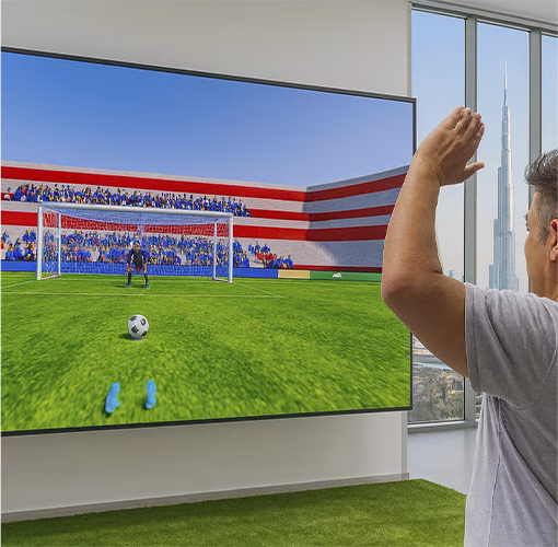 Guests playing a digital soccer penalty shootout game at an event, featuring real-time scoring, interactive gameplay, and customizable branding in the UAE