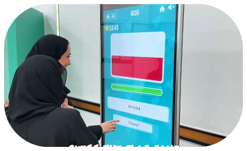 Participants playing the interactive Guess the Flag game at an event, engaging with a fun, branded quiz experience that tests geographical knowledge in a lively setting.